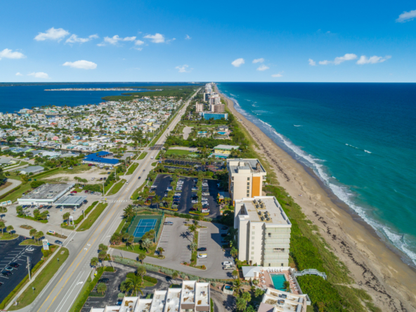 Aerial view of a coastal city with beaches and buildings.