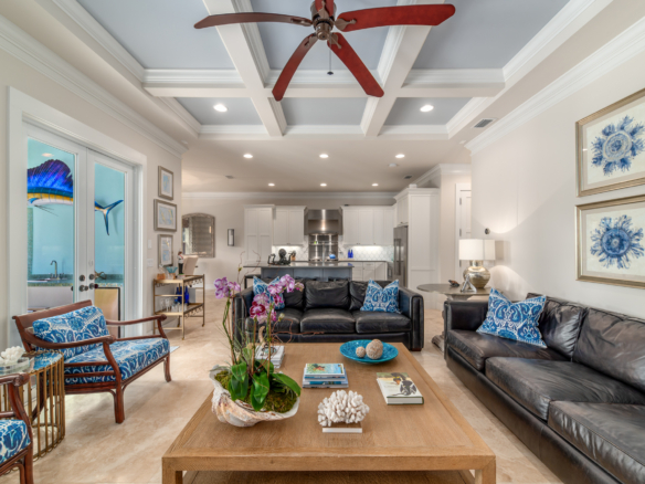 Elegant living room with high ceilings, modern lighting, and stylish furniture.