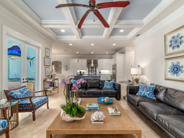 Elegant living room with high ceilings, modern lighting, and stylish furniture.
