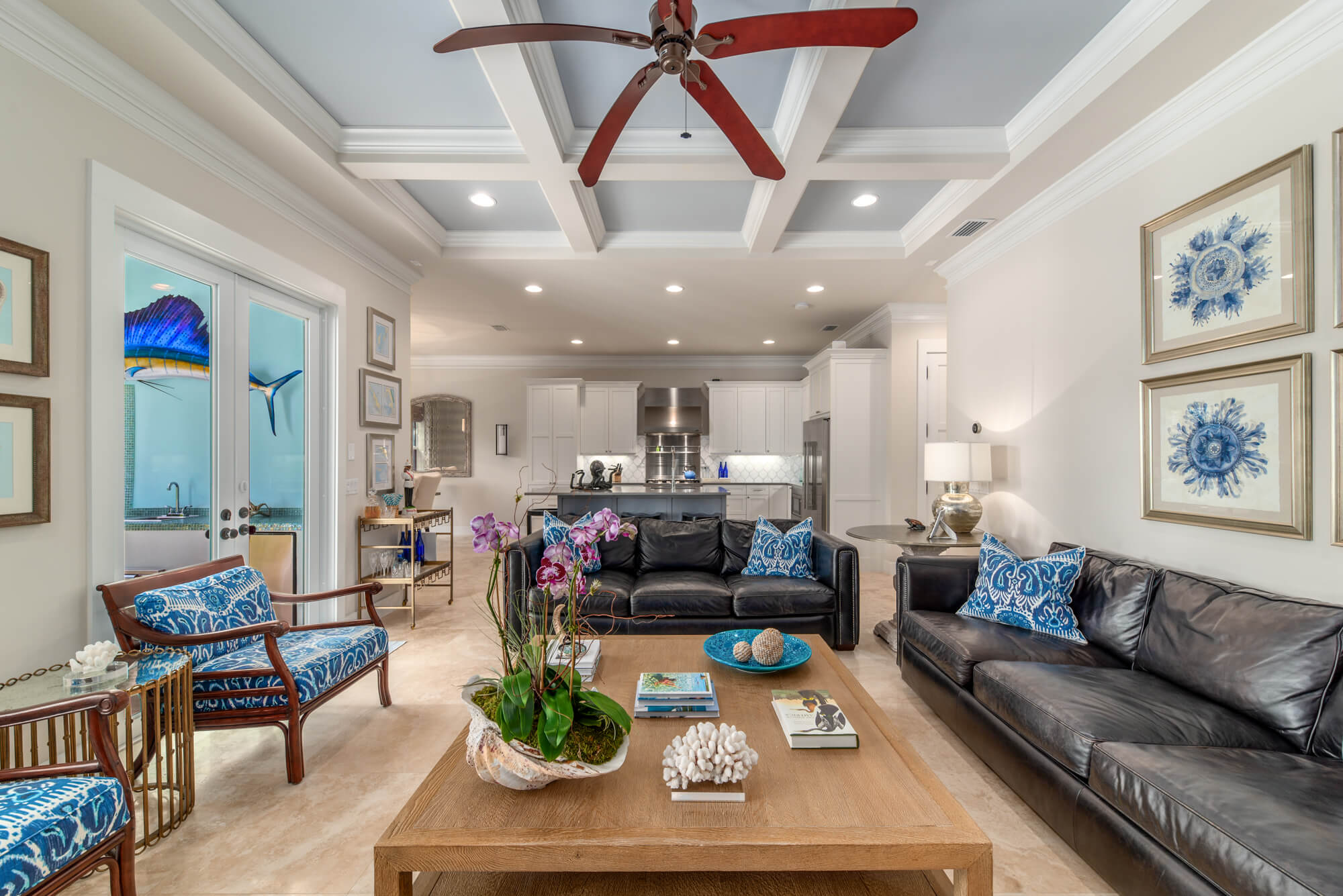 Elegant living room with high ceilings, modern lighting, and stylish furniture.
