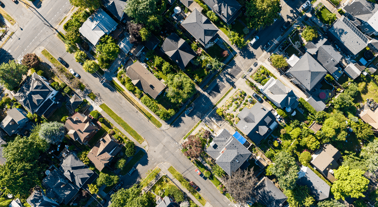 Aerial view of suburban neighborhood and streets.